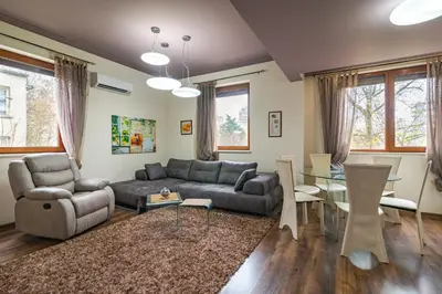 a living room with a couch and a table at Cosy Luxury Flat in the Centrum- 90sqm - 3 rooms. in Varna City