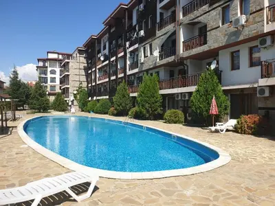 a swimming pool in front of a building at MitProt Panorama Bay 2 luks Apartment 173 in Sveti Vlas