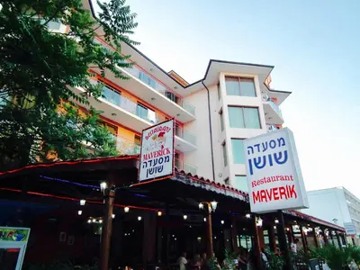 a building with street signs in front of it at Maverick Hotel in Sunny Beach