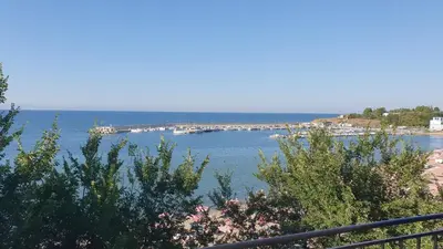 a view of a bay with boats in the water at Студия първа линия Черноморец in Chernomorets
