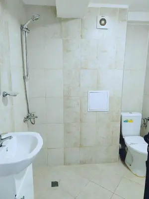 a bathroom with a sink and a toilet at Guest House Elidis in Primorsko