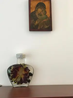 a vase sitting on a table next to a painting at Sun Village Villa 6 in Byala