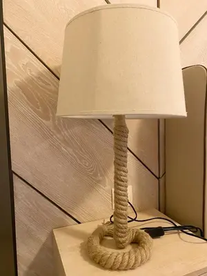 a lamp with a rope wrapped around a lamp shade at Gradina Forest Villas in Sozopol