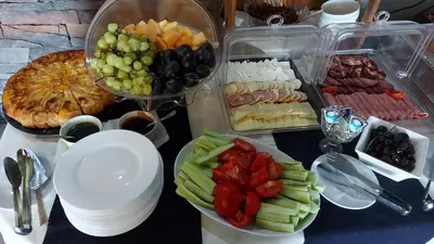 a table with a bunch of different types of food at Vila Vista Вила Виста in Sveti Vlas