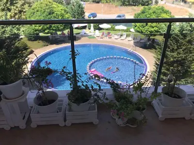 a view of a swimming pool from a balcony at Lux Sozopoli Hills Apartments A19 и Studio А13 in Sozopol