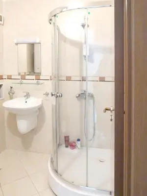 a bathroom with a shower and a sink at Comfortable apartment in Slantchev Briag 65 m² Shared pool in Sunny Beach