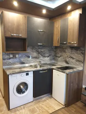 a kitchen with a washing machine and a sink at MitProt luks studio Panorama Bay 2 ap39 in Sveti Vlas