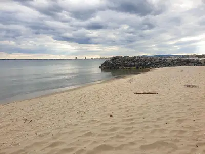 a beach with a bunch of rocks in the water at MitProt luks studio Panorama Bay 2 ap39 in Sveti Vlas