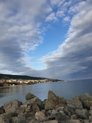 a group of rocks on the shore of a body of water at MitProt luks studio Panorama Bay 2 ap39 in Sveti Vlas