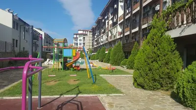 a park with a playground in the middle of a building at MitProt luks studio Panorama Bay 2 ap39 in Sveti Vlas