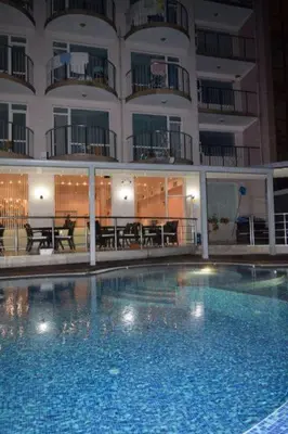 a large swimming pool in front of a building at хотел Свети Николай Приморско in Primorsko