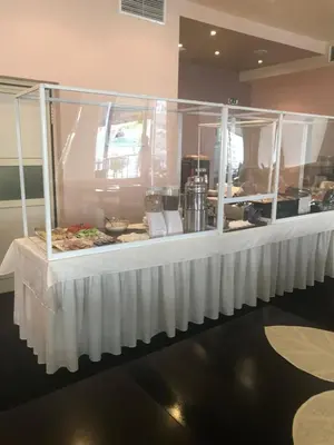 a buffet line with food on display in a restaurant at хотел Свети Николай Приморско in Primorsko