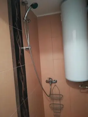 a shower with a shower head in a bathroom at Studio Yana *Top location*Sea Garden* in Varna City