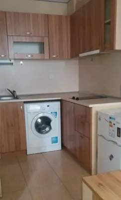 a kitchen with a washing machine and a dishwasher at APARTAMENT PRIMERA in Varna City