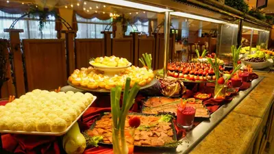 a buffet with many different types of food on display at DIT Majestic Beach Resort in Sunny Beach