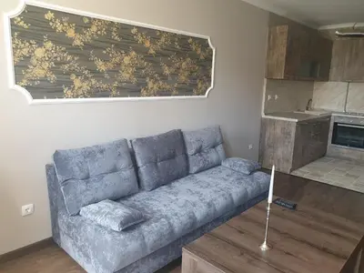a living room with a couch and a kitchen at Mit Prot luks Apartment Panorama Bay 2 ap109 in Sveti Vlas
