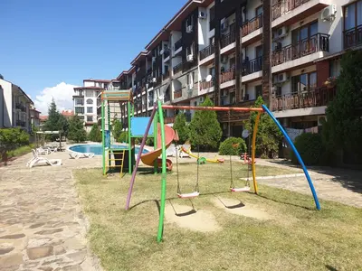 a playground in front of a apartment building at Mit Prot luks Apartment Panorama Bay 2 ap109 in Sveti Vlas
