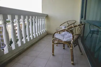a balcony with a table and chairs on a balcony at Private Studio in Planet Hotel, Sunny Beach Center by Flаt Manаger in Sunny Beach