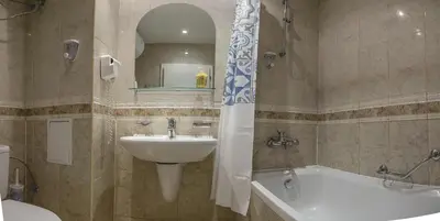 a bathroom with a sink and a toilet and a tub and a sink at Private Studio in Planet Hotel, Sunny Beach Center by Flаt Manаger in Sunny Beach