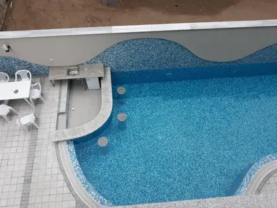 an overhead view of a swimming pool with blue water at Таня 10 in Pomorie