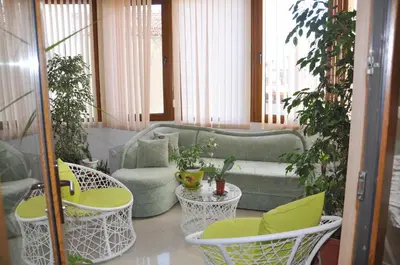 a living room with a couch and chairs at Guest rooms Sveti Nikola in Pomorie