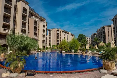 a large swimming pool in a city with buildings at Menada Apartments in Cascadas in Sunny Beach