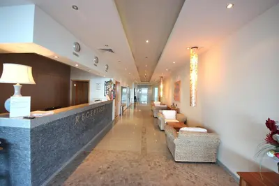 a hotel lobby with couches and a waiting room at Menada Sozopol Apartments in Sozopol