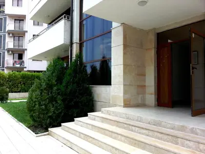 a building with stairs in front of a building at Eden - Menada Apartments in Sunny Beach
