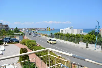 a view of a street with cars on the road at Мезонет Сиракови in Sozopol