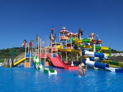 a group of water slides in a water park at Мезонет Сиракови in Sozopol