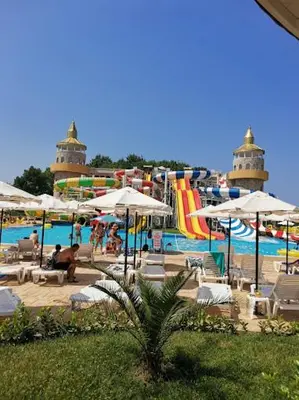 a pool with a water park with a water slide at Мезонет Сиракови in Sozopol