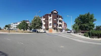 a building on the side of a street at Апартамент КИМАКО 2, 100м2 на цена за хотелска стая за двама in Tsarevo