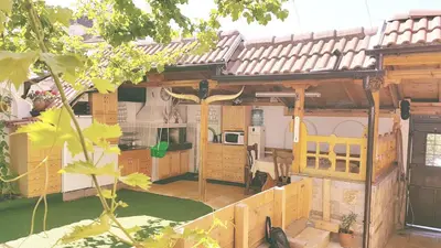 a model of a house with a roof at Апартамент КИМАКО 2, 100м2 на цена за хотелска стая за двама in Tsarevo