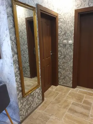 a bathroom with a mirror and a door at MitProt Panorama Bay 2 luks apartment 102 in Sveti Vlas