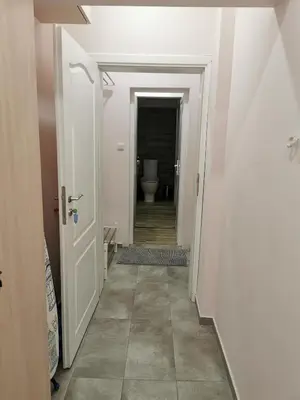 a hallway with a toilet in a bathroom at Studio Thermi 1 in Varna City
