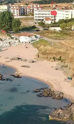 an aerial view of a beach with buildings in the background at Perla Del Mar Aparthotel in Lozenets