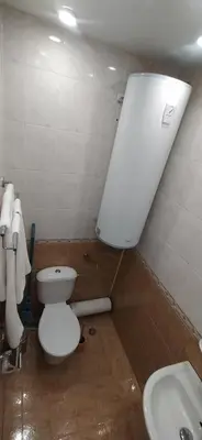 a bathroom with a toilet and a sink at Studios near to Burgas Free University in Burgas City