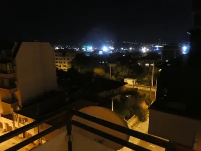 a view of a city at night with lights at SEA PANORAMA appartment in Varna City