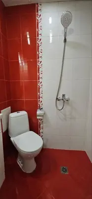 a bathroom with a toilet and a shower at SEA PANORAMA appartment in Varna City