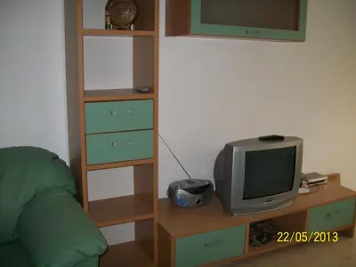 a living room with a television and a couch at Apartment in Kambani 1 Apartcomplex in Sveti Vlas