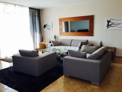 a living room with two couches and a table at PSB Apartments in Midia Resort Aheloy in Aheloy