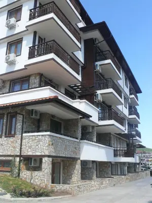 a building with balconies on the side of it at Complex Kentavar - Free Fast WiFi in Sveti Vlas