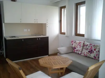 a small living room with a couch and a table at Complex Kentavar - Free Fast WiFi in Sveti Vlas