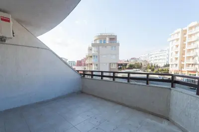 a balcony with a view of a city with buildings at Dom-El Real Apartments Amphora in Sveti Vlas