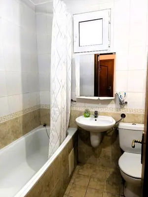 a bathroom with a sink and a tub and a toilet at Dom-El Real Apartments 4 - Sveti Vlas in Sveti Vlas