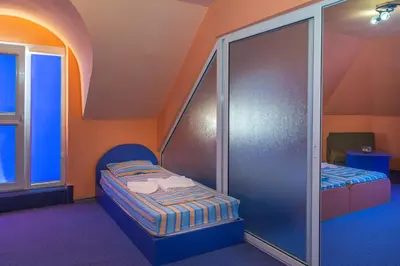 a small room with a bed and a window at Dara Hotel in Primorsko