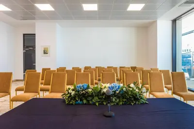 a conference room with a table and chairs at Marina Burgas Hotel in Burgas City