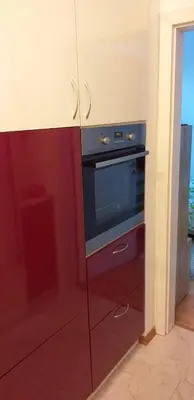 a kitchen with a black oven in a room at Aphrodite Rose in Sunny Beach