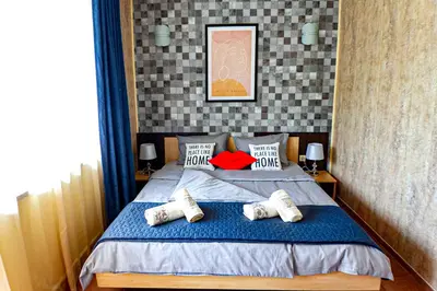 a bedroom with a bed with pillows on it at Favorit Aparthotel in Sunny Beach