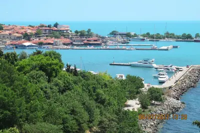 a group of boats are docked in a harbor at Black Sea Apartment in Nesebar